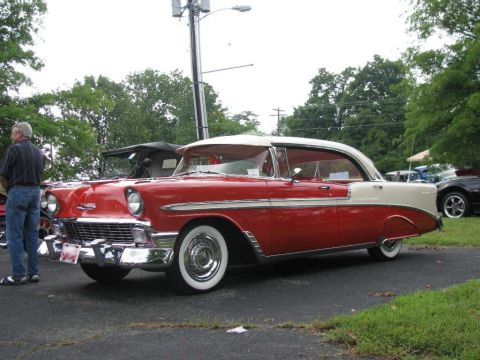 2003 Mercury Marauder - A classic red and white two-door hardtop is parked at an outdoor event, with other vehicles visible in the background.