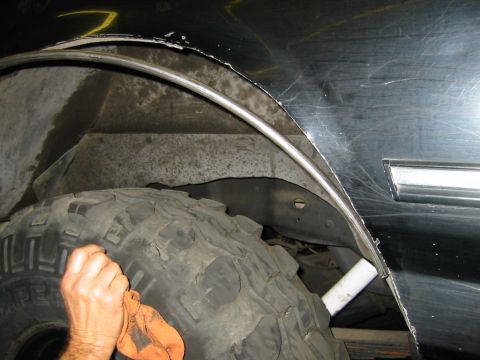 1992 Ford Bronco - Shaping 1/2 steel tube around opening. It fits between outer and inner sheet metal -- HUGE strength improvement and no biggie if the tire r…