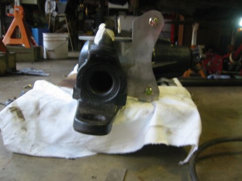 1995 Ford Bronco - A steering gear box is shown resting on a white cloth in a garage setting.