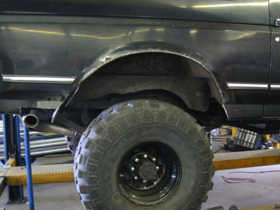 All tacked into place... grinding and bondo to come!  OK, so I got carried away and changed the exhaust routing, too!