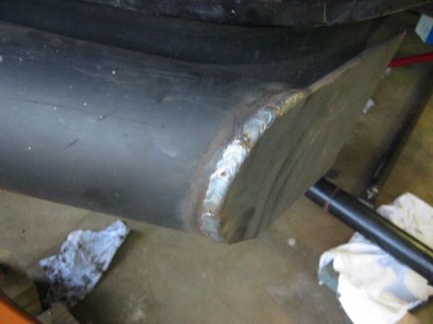 1995 Ford Bronco - This image shows a close-up of a metal component with fresh welds, suggesting a modification or repair.