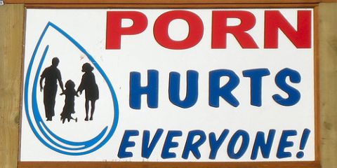 1991 Ford Bronco - A sign displays the message 'PORN HURTS EVERYONE!' with a family silhouette inside a water drop graphic.