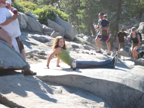 1999 Jeep Grand Cherokee - A woman poses on a rock while others hike in the background.
