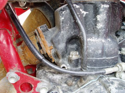 2000 Ford E350 - Close-up of a motorcycle engine component, showing wear and tear.