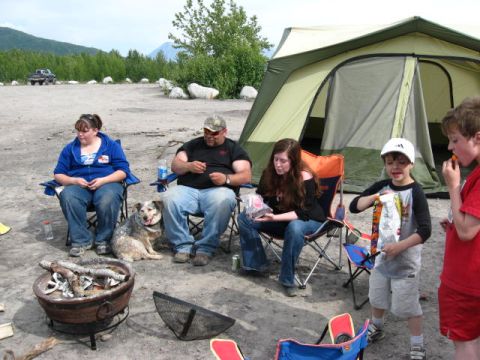 1978 Ford Bronco - A family enjoys a camping trip with a tent and campfire.