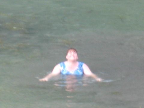 1978 Ford Bronco - Woman swimming in water.