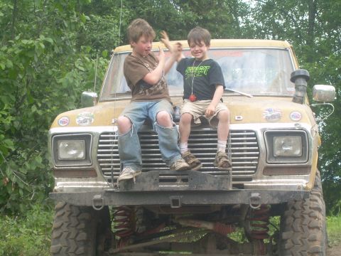 1978 Ford Bronco - Two boys sit on the front of a yellow Ford truck, which appears to be a 1977 model.