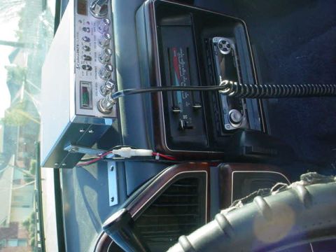1991 Ford Bronco - Close-up of a vehicle's interior, focusing on the CB radio and dashboard controls.