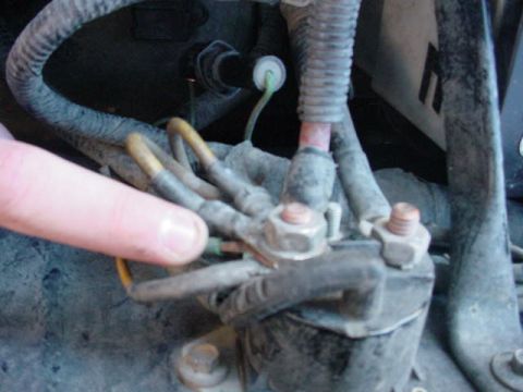 1991 Ford Bronco - my finger is pointing to the wire that was not connected to the solenoid because there wasn't abig enough hole for the wire to fin the conn…