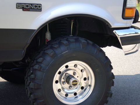 1996 Ford Bronco - Same as the rear, the front has room for travel with the bumper trimmed. The tires tuck just inside the wheel openings front & rear. Replac…