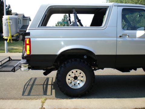 1996 Ford Bronco - Sits level in the back, just a hair higher for extra passengers weight.