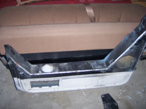 1991 Ford Bronco - Close-up of a Ford Bronco's rear bumper assembly, showing its metallic finish and structure.