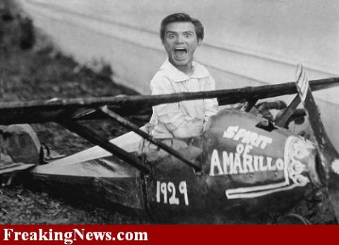 1991 Ford Crown Victoria - Man in the cockpit of a biplane, identified as the "Spirit of Amarillo" and dated "1929".