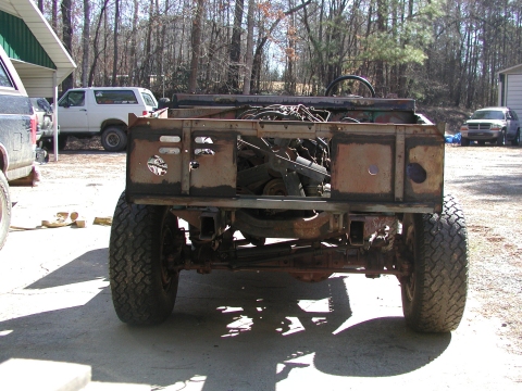 1967 Ford Bronco - This heavily modified off-road vehicle is missing its body panels and appears to be undergoing restoration or customization.