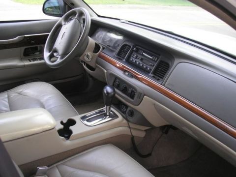 1996 Ford Crown Victoria - Interior view of a 1996 Ford Crown Victoria, highlighting the dashboard and seating.