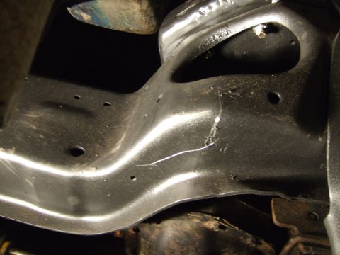 1989 Ford Bronco - Crossmember hits oil filter. Plasma cutter would be nice, but out comes the grinder.