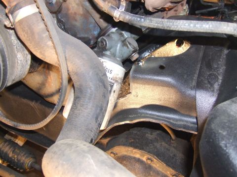 1989 Ford Bronco - Close-up view of engine components, including hoses and an oil filter with visible part number 515.