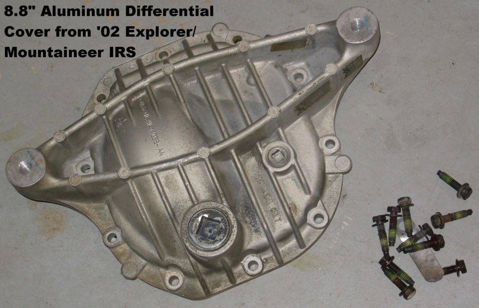 Aluminum 8.8-inch differential cover from a 2002 Explorer IRS with mounting bolts