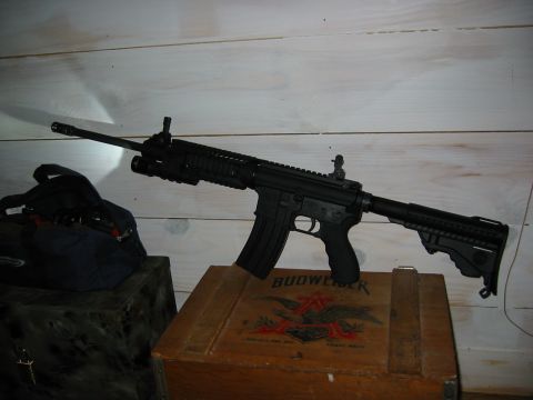 1996 Ford Bronco - An AR-style rifle is displayed on a wooden crate with a Budweiser logo.