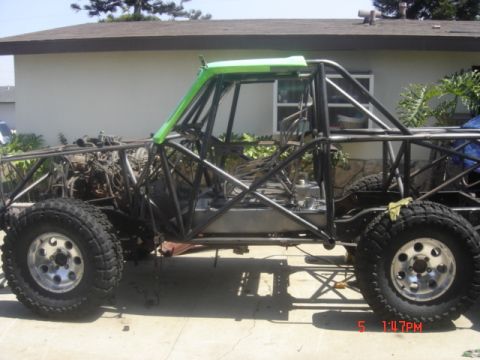 1995 Ford Bronco - This custom off-road vehicle is undergoing modifications, with its frame and engine exposed.