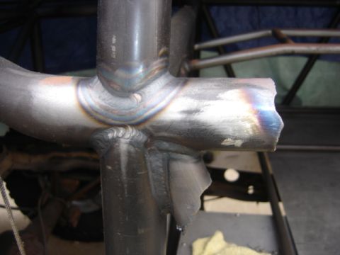 1995 Ford Bronco - Welding joins on metal tubing are visible, with some discoloration from heat.