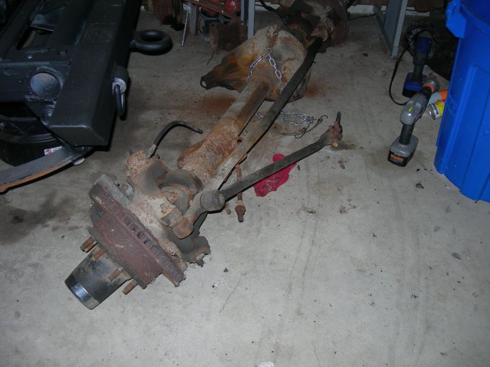 front axle assembly with brake rotor and tie rods