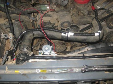 1988 Ford Bronco - i put some split loom around the yellow wire and put it going across the top of the radiator.