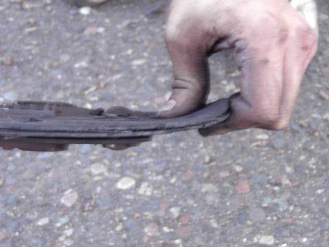 1991 Ford Probe - This brake pad is severely worn and needs replacement.