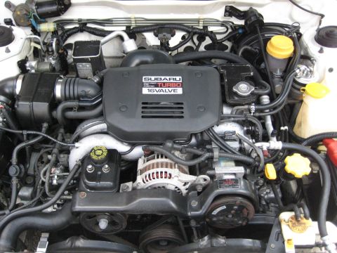 1980 Ford Bronco - Close-up view of a Subaru turbocharged engine, showing various components and hoses.