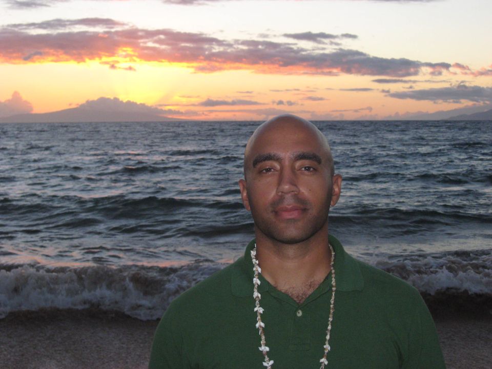Man on beach at sunset