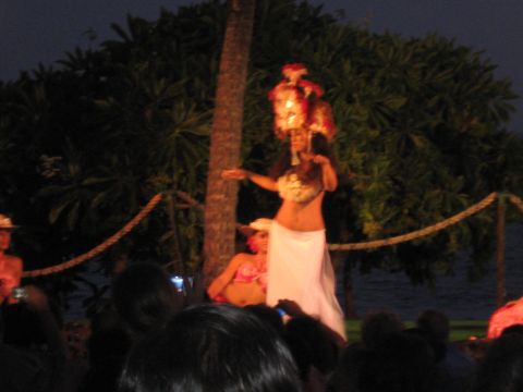 1991 Ford Bronco - A hula performance takes place outdoors after dark, with spectators watching the dancers.