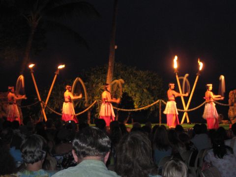 1991 Ford Bronco - Dancers perform with torches at a nighttime luau in Hawaii.
