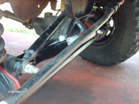 1982 Ford F-100 - Close-up of the steering and suspension system on a 1982 Ford F-100.