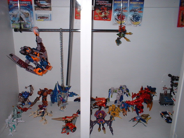 Collection of Transformers toys displayed on shelves