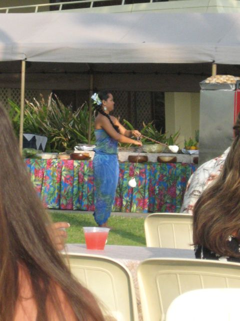 1991 Ford Bronco - A woman in a blue dress performs a traditional dance in front of a buffet table.