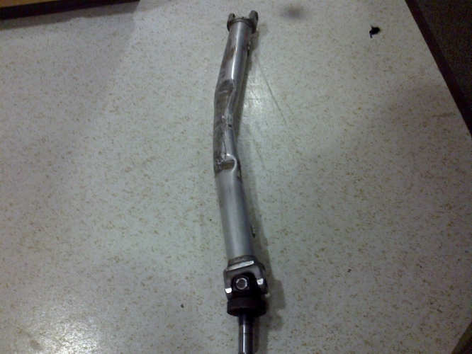 Bent driveshaft with universal joint visible