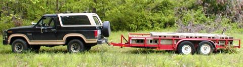 1983 Ford Bronco - There are about 230 concrete blocks on the trailer, and they're destined to be the base of a rock display for Land Rovers.