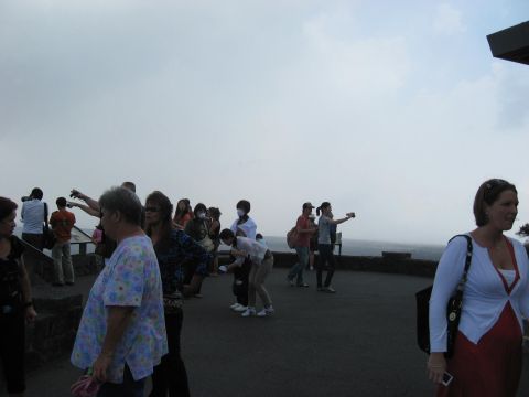 1991 Ford Bronco - Tourists gather on a scenic overlook, some taking photos of the landscape.
