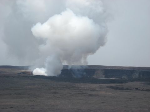 1991 Ford Bronco - A wide view of a volcanic crater with significant smoke and steam rising into the atmosphere.