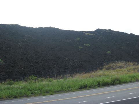 1991 Ford Bronco - A landscape view of a volcanic rock formation next to a road.