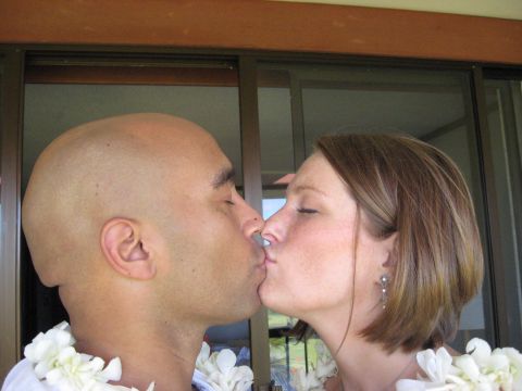 1991 Ford Bronco - A couple shares a kiss while wearing leis.