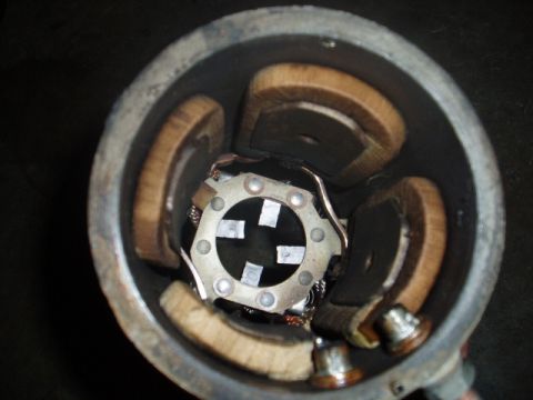 1980 Ford Bronco - A close-up, top-down view of the internal components of a motor, likely from a 1980 Ford Bronco. The image shows copper windings, a metal a…
