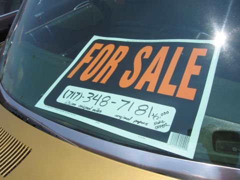 2001 Ford Crown Victoria - Car windshield displays a 'For Sale' sign with contact information and price.