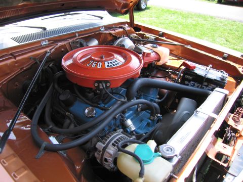 2001 Ford Crown Victoria - Photograph of a Mopar 360 four-barrel engine in its bay, not a technical document.