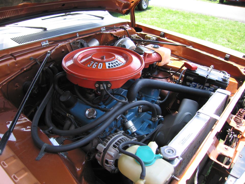 Engine bay of a Plymouth with 360 Four Barrel air cleaner