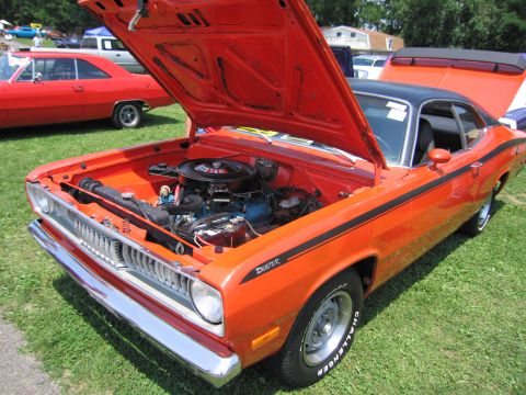 2001 Ford Crown Victoria - Photograph of an orange Plymouth Duster with engine visible, not a technical document.