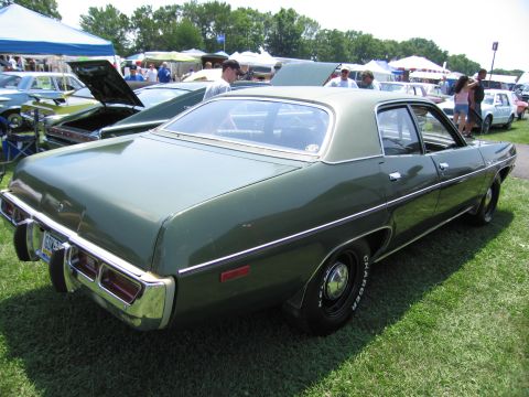 2001 Ford Crown Victoria - Photograph of a green Dodge four-door sedan, not a technical document.