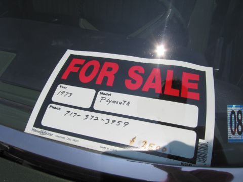 2001 Ford Crown Victoria - Photograph of a handwritten FOR SALE windshield sign, a classified notice rather than a technical document.