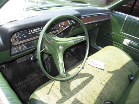 2001 Ford Crown Victoria - Photograph of a vintage green sedan interior, not a technical document.