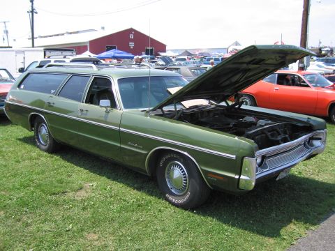 2001 Ford Crown Victoria - Photograph of a green Plymouth wagon with open hood, not a technical document.
